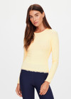 THE UPSIDE women's yellow organic cotton Arlo Pointelle Long Sleeve Top is a soft and comfortable fit and features a crew neck and ruffle lace edge tonal trim. Made for lifestyle.