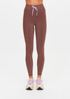 THE UPSIDE women's chocolate metallic Galaxia 25inch Legging is mid-rise and features a purple drawcord with aglets and embroidered purple arrow logo. Made for yoga and pilates.