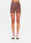 THE UPSIDE women's chocolate metallic Galaxia 4inch Spin Short is mid-rise and features a purple drawcord with aglets and purple rib binds down side seams. Made for yoga and pilates.