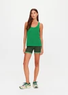THE UPSIDE women's green organic cotton La Paz Riva Knit Tank is a basketball tank style featuring an open knit construction and a knitted palm tree detail on back. Made for lifestyle.
