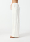 THE UPSIDE women's cream La Paz Malika Wide Leg Pant is a mid-rise straight leg fit and features an elasticated back waistband, an orange drawcord, an embroidered palm tree motif and side seam pockets. Made for lifestyle.
