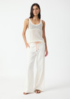 THE UPSIDE women's cream La Paz Malika Wide Leg Pant is a mid-rise straight leg fit and features an elasticated back waistband, an orange drawcord, an embroidered palm tree motif and side seam pockets. Made for lifestyle.