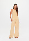THE UPSIDE women's yellow Soho Tokio Wide Leg Pant is designed for a relaxed fit and features an elasticated waistband, front pockets and embroidered arrow logo. Made for everyday.