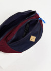 THE UPSIDE women's maroon and navy colour block Trail Bum Bag is made from recycled fabric and features an adjustable strap with a quick release buckle.