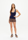 THE UPSIDE women's navy Joey Knit Tank Top is made from an organic cotton blend fabric and features a scoop neck and contrast tan and butter yellow stripes.