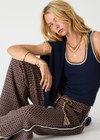 THE UPSIDE women's navy Joey Knit Tank Top is made from an organic cotton blend fabric and features a scoop neck and contrast tan and butter yellow stripes.