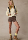 THE UPSIDE women's butter yellow Boo Cable Knit Sweater is made with organic cotton and features a patch pocket at chest and ribbed cuff, neck, and hem.