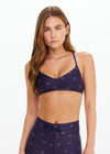THE UPSIDE women's navy horseshoe print Cheval Zoe Sports Bra is made from recycled, super soft and breathable quick-drying fabric and feature adjustable straps.