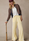 THE UPSIDE women's butter yellow Juliet Low Waist Trackpant is made from a slinky, lightweight fabric and feature side stripes, pockets and a split flared hem.