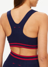 THE UPSIDE women's navy Seamless Jade Racerback Sports Bra is made from soft organic cotton fabric and features a scoop neckline and removable bust cups.