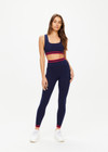THE UPSIDE women's navy Seamless 25 inch Midi Legging is made from soft and comfortable organic cotton fabric and features a ribbed waistband.