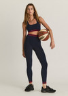 THE UPSIDE women's navy Seamless 25 inch Midi Legging is made from soft and comfortable organic cotton fabric and features a ribbed waistband.