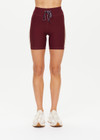 THE UPSIDE women's maroon Trail 6 inch Spin Short is made from soft, breathable fabric and features contrast butter yellow side stripe and an elastic waist.