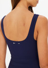 THE UPSIDE women's navy recycled peached fabric Gabbie Mini Dress features internal shelf bra with removal cups for support and built in shorts with pockets. The perfect classic dress for golf or tennis.