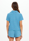 THE UPSIDE women's blue stripe Rio Lilou Polo top features a soft stretch terry fabrication with cropped polo shape and button front. The perfect vacation piece.