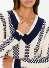 THE UPSIDE women's cream and navy check Sonny V Neck Sweater is a classic V neck knit in organic cotton. The perfect wardrobe addition.