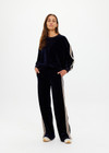 THE UPSIDE women's navy Monaco Freya Wide Leg Pant is a soft recycled velour fabric with side seam pockets and an elasticated waistband. The perfect travel pant.