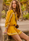 THE UPSIDE women's recycled fabric Prix Dawson Run Jacket in mimosa yellow is light and breathable whilst being water resistant and moisture wicking. Large back pocket with zip makes stow away and packing easy.