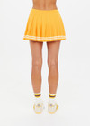 THE UPSIDE women's mimosa yellow recycled fabric Prix Quinny Pleated Skirt features a inner spin short with pockets and elasticated drawcord waist. Made for tennis.