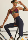 THE UPSIDE women's multicoloured recycled peached Starburst Georgie Scoop Sports Bra is designed for a supportive fit and features removable cups. Made for yoga and pilates.