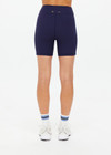 THE UPSIDE women's navy Silverstone 5 Inch Spin Short is a recycled textured rib fabrication with moisture wicking properties. Made for a soft & supportive fit in yoga and pilates.