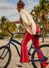 THE UPSIDE women's red Muse Flare Pant is designed for a mid to low rise fit with side seam pockets in a soft suiting fabrication. The perfect everyday or travel pant.