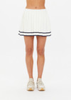 THE UPSIDE women's creme Cadiz Pleated Knit Skirt features an elasticated waistband with navy contrast knitted stripes. Perfect for tennis.