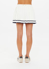 THE UPSIDE women's creme Cadiz Pleated Knit Skirt features an elasticated waistband with navy contrast knitted stripes. Perfect for tennis.
