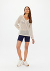 THE UPSIDE women's creme organic cotton Josephine V Neck Knit is a lightweight open knit designed for a relaxed fit with a deep V neckline. Made for everyday.