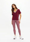 THE UPSIDE women's merlot Sienna V Neck Tee is a retro style slim fit track tee in a lightweight knit and features a deep V neckline. Made for everyday.