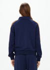 THE UPSIDE women's navy Vitesse Pari Zip Jacket comes in a slinky fabrication with mesh side tapes in contrast orange and side pockets. Designed for everyday leisure.