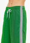 THE UPSIDE women's green Galaxia Loretta Pant is designed for a mid to low rise straight leg fit and features elasticated waistband, drawcord and side seam pockets. Made for lifestyle.