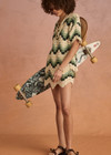 THE UPSIDE women's green organic cotton Tidal Hali Crochet Skirt features a knitted drawcord through waist. The perfect piece for vacation.