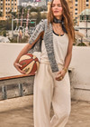 THE UPSIDE women's cream recycled cotton Soho Jacquie Tank Top is designed for a relaxed fit and features a ribbed neckline and armhole. Made for everyday leisure.