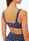 THE UPSIDE women's navy Cruzada Bridie Bra is a soft & supportive fit in a recycled jacquard rib fabrication in mini flag design and features removable cups. Made for yoga & pilates.