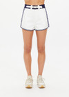 THE UPSIDE women's white organic cotton Racer Short features a navy waistband with a built-in belt detail and back welt pockets. Made for everyday leisure.