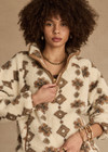THE UPSIDE women's beige recycled fleece fabrication Harlow Fleece Pullover is a relaxed pullover style with quarter zip through and zip pockets.