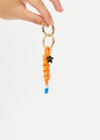 THE UPSIDE women's Orange Limitless Keyring charm with gold metal star and macrame paracord in bright orange with rubber dipped ends.