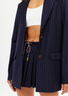 THE UPSIDE women's navy pinstripe merino Wool Boyfriend Blazer is a fully lined single breasted blazer with branded tortoiseshell buttons. Lean into a polished kind of comfort with our Wool Boyfriend Blazer.