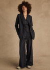 THE UPSIDE women's navy pinstripe merino Wool Boyfriend Blazer is a fully lined single breasted blazer with branded tortoiseshell buttons. Lean into a polished kind of comfort with our Wool Boyfriend Blazer.