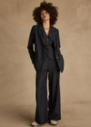 THE UPSIDE women's navy pinstripe merino Wool Mira Wide Leg Pant features a flat waistband with belt loops and side pockets.