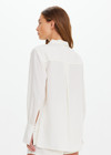 THE UPSIDE women's cream Hotel Du Cap Long Sleeve Shirt is made from tencel linen blend. The button up shirt features wide sleeve cuffs. Designed for layering and travel.