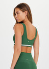 THE UPSIDE women's green Il Pelicano Scoop Bra is made from recycled rib. The scoop neck sports bra features removable cup. Designed for yoga and exercise.