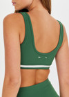 THE UPSIDE women's green Il Pelicano Scoop Bra is made from recycled rib. The scoop neck sports bra features removable cup. Designed for yoga and exercise.