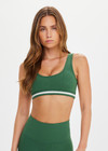THE UPSIDE women's green Il Pelicano Scoop Bra is made from recycled rib. The scoop neck sports bra features removable cup. Designed for yoga and exercise.