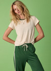 THE UPSIDE women's cream Dusty-Ray 70s Tee is made from hemp and organic cotton blend. The classic inspired t-shirt features rib neckline. Designed for comfort.