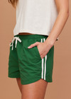 THE UPSIDE women's green Tennis in Bahamas Run Short is a mid rise short with a drawstring. Designed for running and exercise.