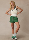 THE UPSIDE women's green Tennis in Bahamas Run Short is a mid rise short with a drawstring. Designed for running and exercise.
