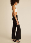 THE UPSIDE women's black classic Joyela Flare Pant is made from a lenzing viscose blend and features an embroidered arrow at the black.