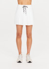 THE UPSIDE women's white Cadiz Pleated Skirt is made from a recycled lightweight fabric and features a drawcord on waist and built-in inner short with pockets. Made for tennis.